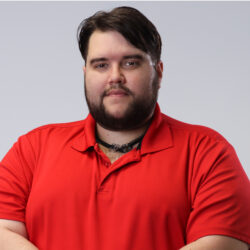 Jeremy - Staff member at Community Real Estate. A male, with dark hair and beard, wearing a red polo.